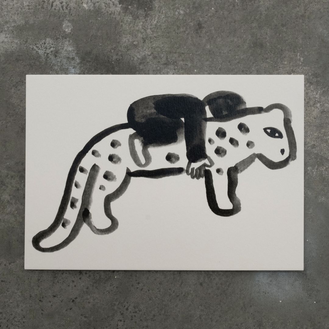 Artistic black and white illustration of a person riding on the back of a jaguar, painted on a white canvas against a grey backdrop.