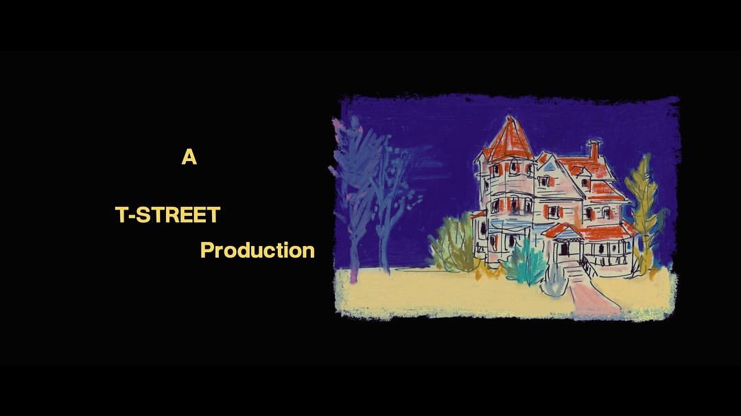 Illustration of a spooky house at night, with visible text 'A T-STREET Production', set against a black backdrop.