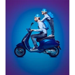 Man and child in blue helmets riding a blue scooter against a saturated blue studio gradient background.