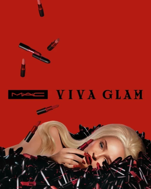 MAC Viva Glam promotional image featuring a blonde woman surrounded by lipsticks against a bold red backdrop with MAC Viva Glam logo.