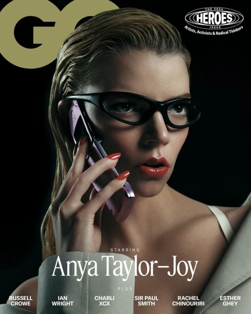 Magazine cover featuring Anya Taylor-Joy wearing glasses and holding a cell phone, against a dark background with GQ logo.