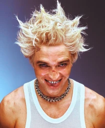 Portrait of a man with spiky bleached blond hair, silver grillz, heavy chain necklace, and a white tank top by Jack Bridgland.