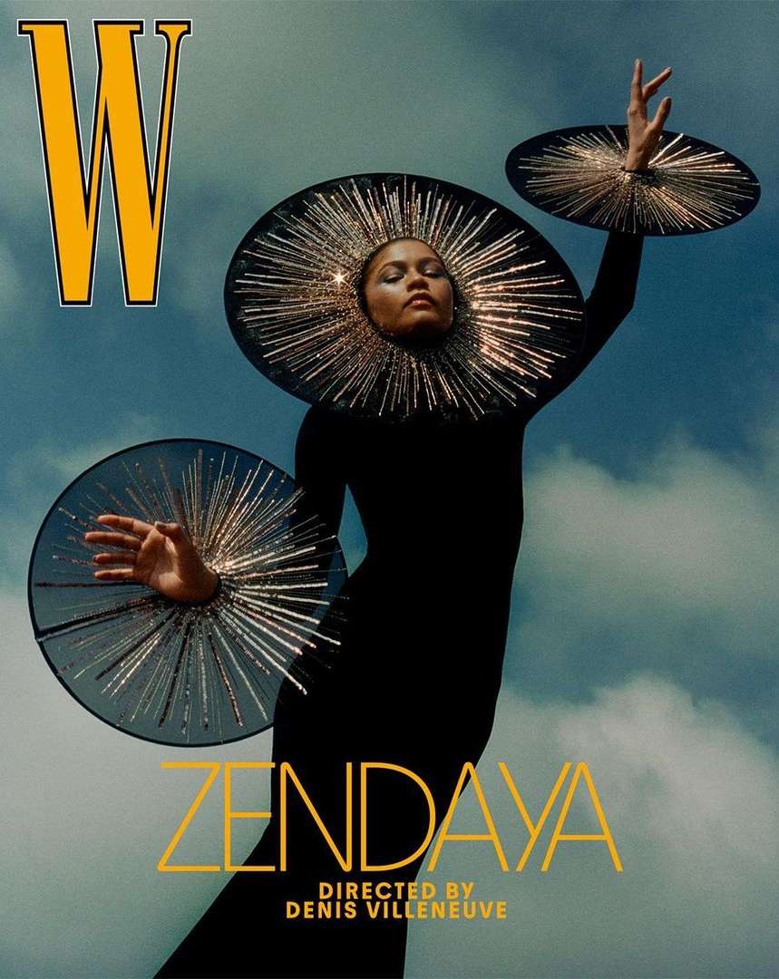W Magazine cover featuring Zendaya in black dress with sun-like discs, against a blue sky, directed by Denis Villeneuve.