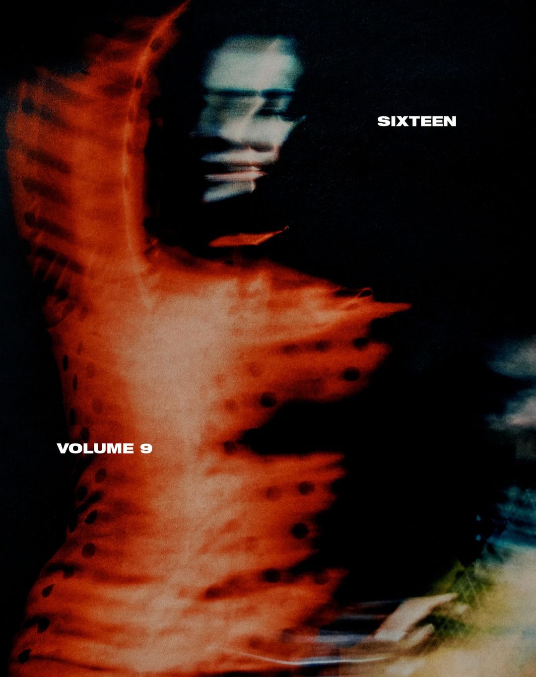 Abstract fashion photo of a person in a blurry red dress, set against a dark background, with text 'SIXTEEN VOLUME 9'.