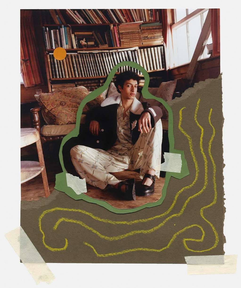 Young adult man in patterned pyjamas and jacket, sitting on floor in front of bookshelf, collage style with drawn elements and tape.