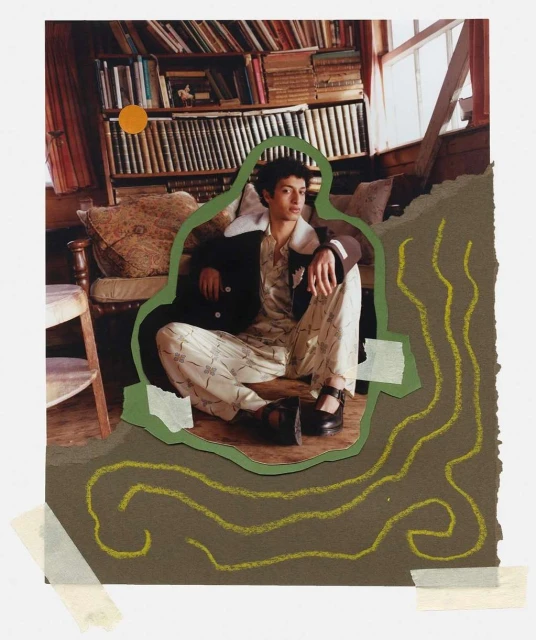 Young adult man in patterned pyjamas and jacket, sitting on floor in front of bookshelf, collage style with drawn elements and tape.