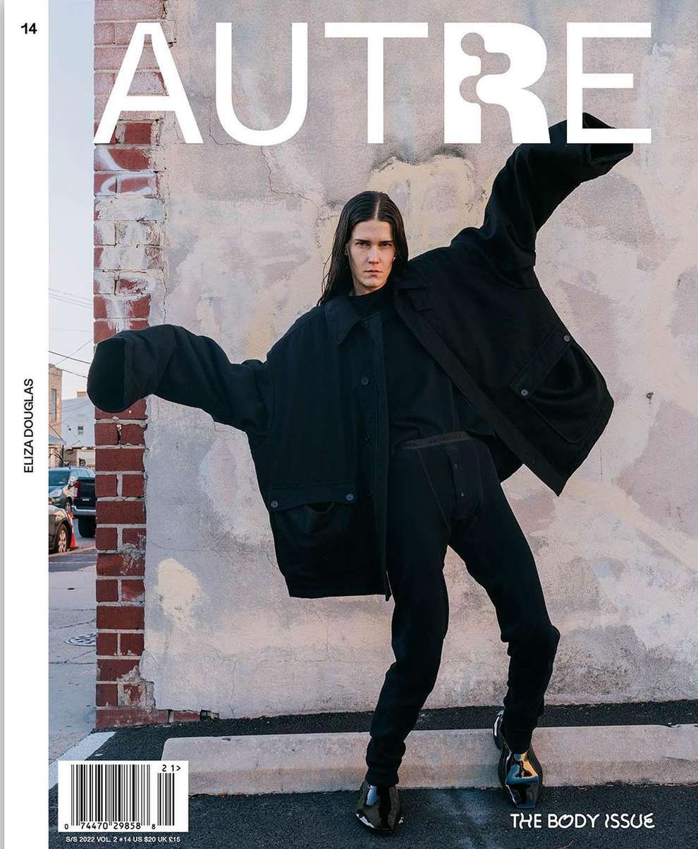 Magazine cover featuring a person in a black outfit posing in front of a weathered wall with the word 'AUTRE' in large white letters.