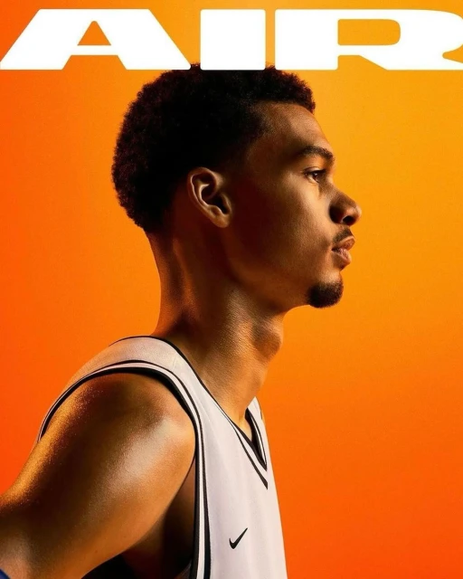 Profile of a young man in a basketball jersey against an orange background with the text 'AIR' at the top.