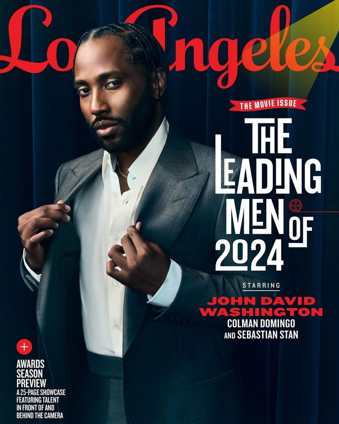 Magazine cover featuring John David Washington in a suit against a dark blue curtain backdrop with bright red and white magazine text.