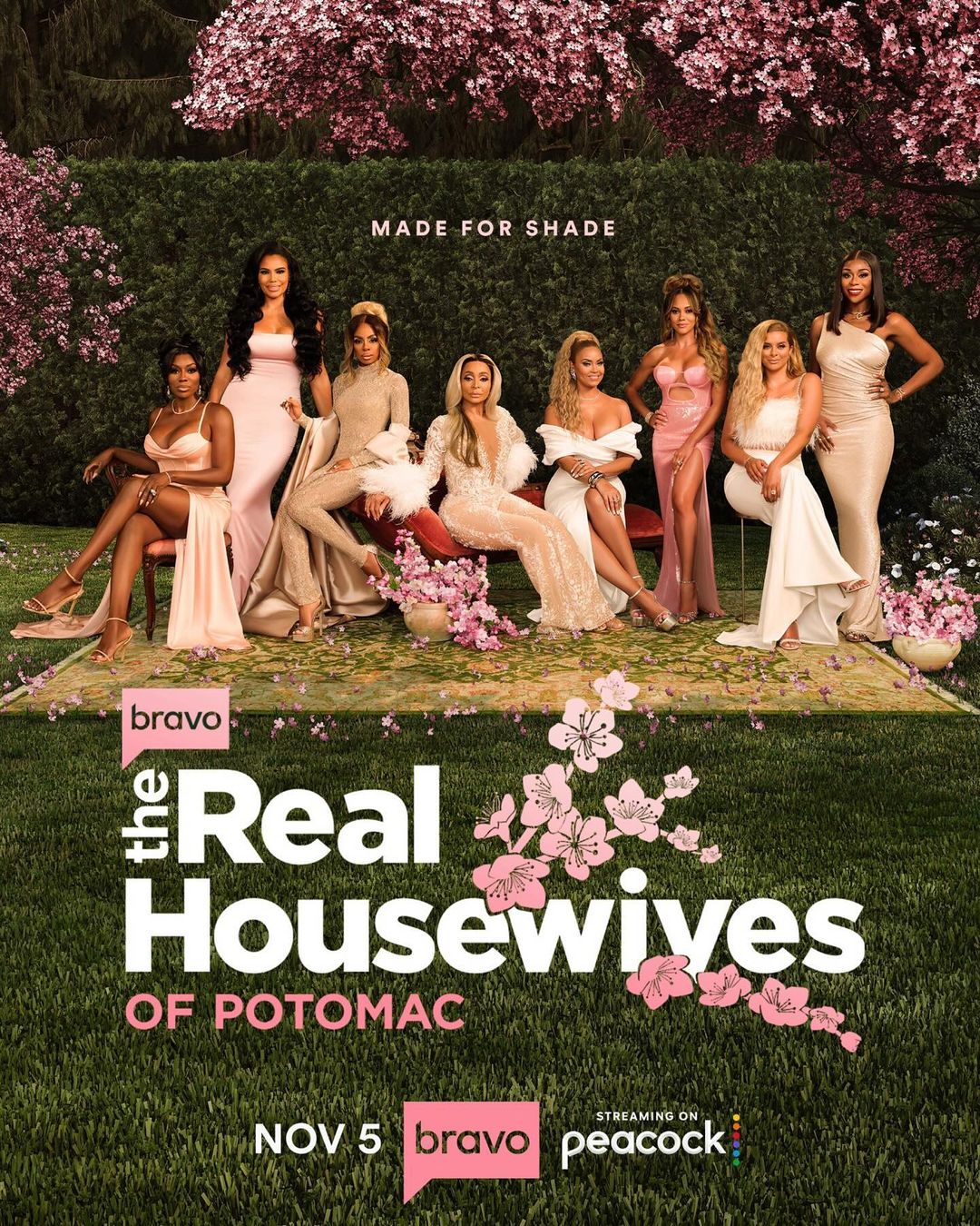 Promotional poster featuring the cast of The Real Housewives of Potomac in gowns, seated outdoors with pink flowers and greenery.