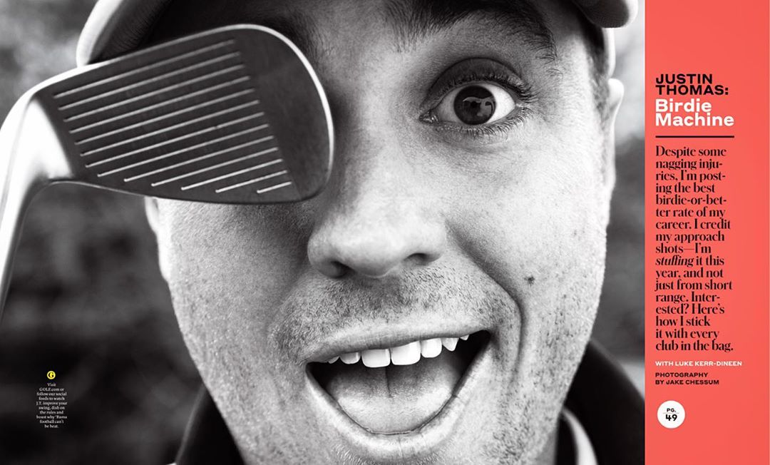 Black and white portrait of a smiling man with a golf club covering one eye, eye-level angle, and close-up shot, indoor studio photography.