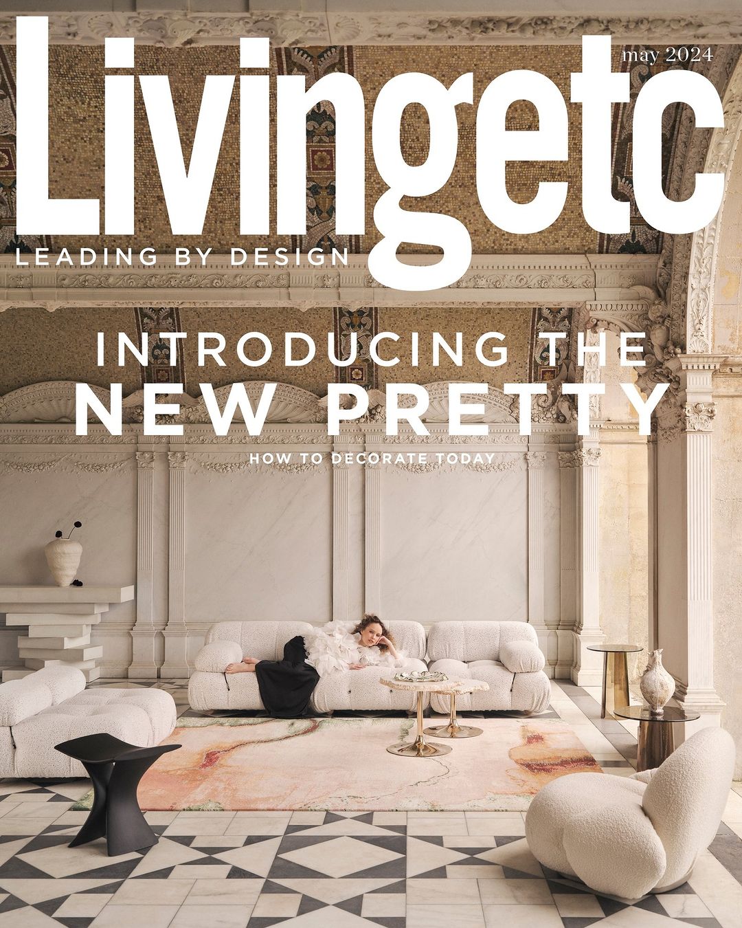 Livingetc magazine cover featuring a woman reclining on a white sofa in an ornate room, showcasing home decor and interior design.