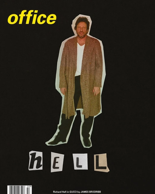 Magazine cover featuring a person in a long coat and the words 'office' and 'hell' against a black background in a studio setting.