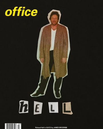 Magazine cover featuring a person in a long coat and the words 'office' and 'hell' against a black background in a studio setting.