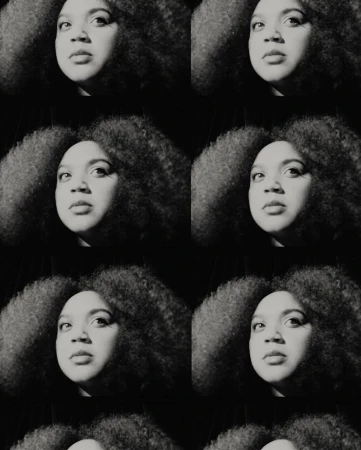 Monochrome portrait of a Black woman with afro in repeating pattern, creating a visually striking and artistic textured effect.