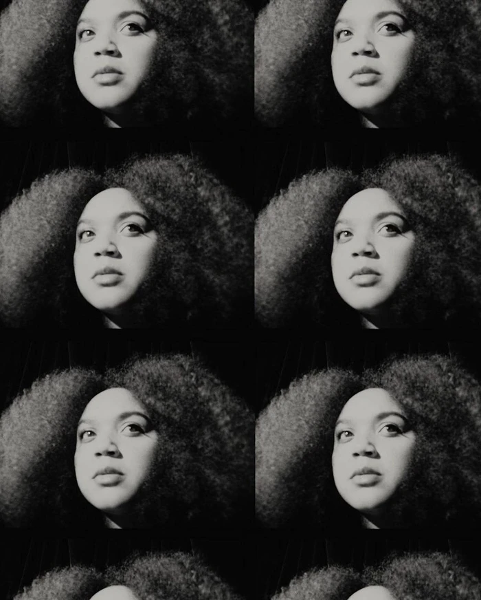 Repeated monochrome portrait grid of a woman with voluminous dark curly hair captured by James Brodribb