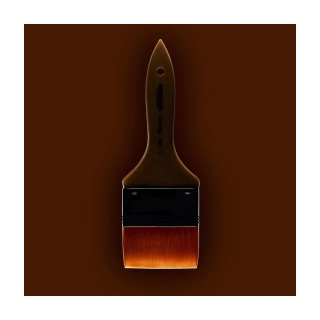 Angled shot of a paint brush with brown bristles and a brown handle on a brown background, showcasing simple composition and warm tones.