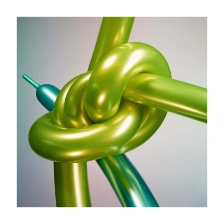 Close-up of two glossy, twisted balloon animals: one bright green, the other teal, set against a muted gray backdrop.