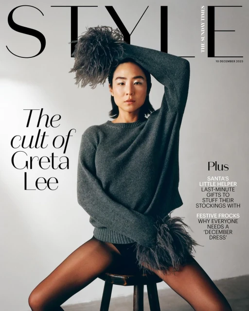 Fashion magazine cover featuring an East Asian woman in a sweater and tights, seated on a stool, with 'STYLE' and other text.