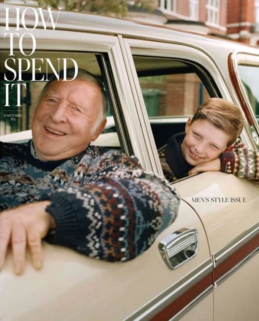 Magazine cover features an older man and a young boy smiling in a vintage car, promoting a men's style issue with an outdoor setting.
