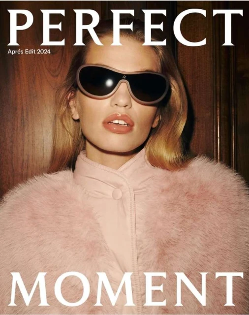 Fashion magazine cover featuring a female model with sunglasses, wearing a pink furry jacket and a pink shirt, posing indoors.