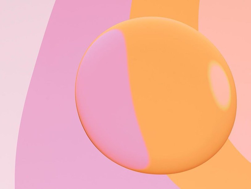 Abstract still life featuring an orange sphere against pink and peach color block background, creating a minimalist and modern visual.
