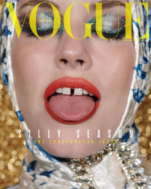 Vogue cover features a young adult woman with glitter eyeshadow, red lipstick, and tongue sticking out, wearing a patterned headscarf.
