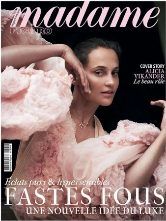 Alicia Vikander on Madame Figaro cover in flowing pink dress. Close-up portrait, star necklace, hands near face, and elegant magazine design.