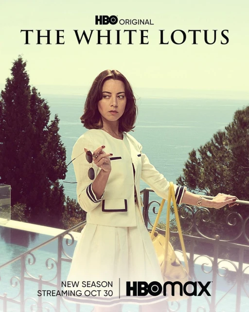 Aubrey Plaza in a promotional poster for The White Lotus Season 2, standing near a pool with the ocean as a backdrop.