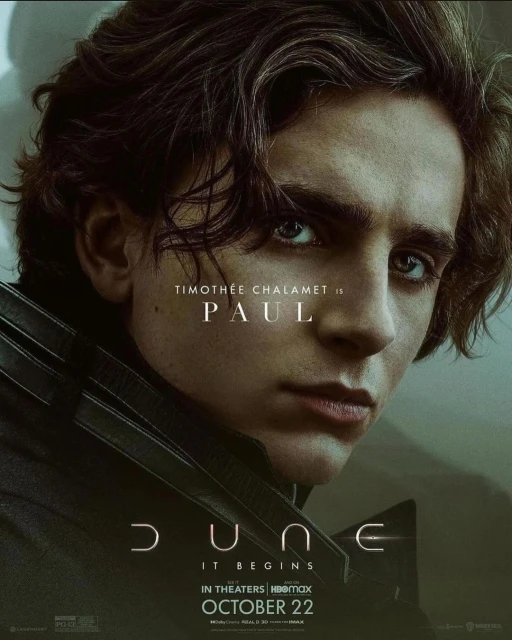 Close-up of Timothée Chalamet as Paul in the Dune movie poster, with dark hair, serious expression, and visible movie branding and release date.