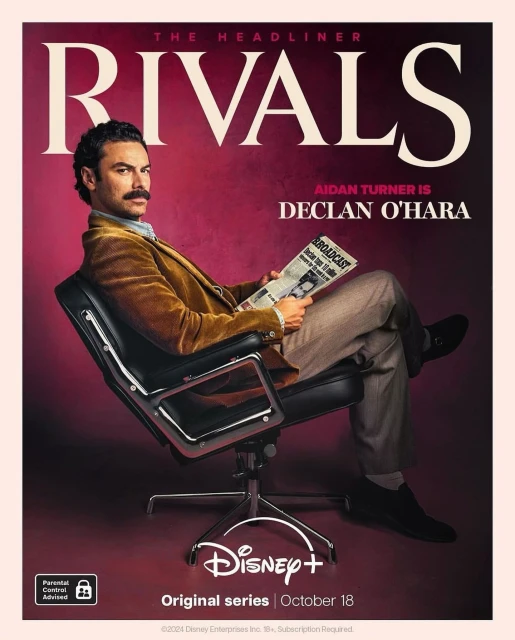 Aidan Turner sits in an office chair, reading a newspaper with 'Rivals' above his head, on a promotional poster for Disney+ original series.