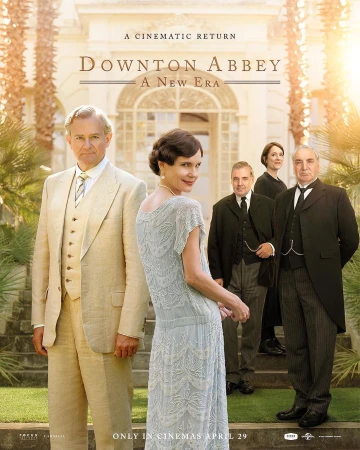 Movie poster for Downton Abbey: A New Era features formally dressed cast in front of an estate, promoting a cinematic return in April.