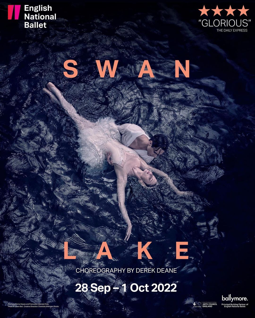 Ballet performance of Swan Lake featuring a ballerina in a white dress and a male dancer in a dark lake setting.