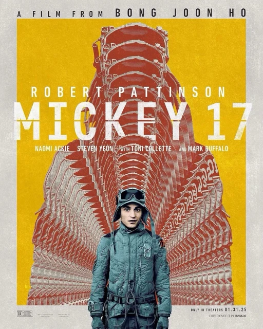 Movie poster for 'Mickey 17' featuring Robert Pattinson in a quilted jacket and goggles, set against a yellow and red graphic background.