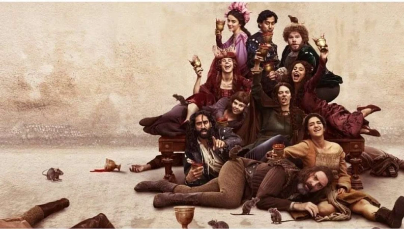 A group of people in medieval-style costumes gather and toast with goblets on a beige background, with several rats at their feet.