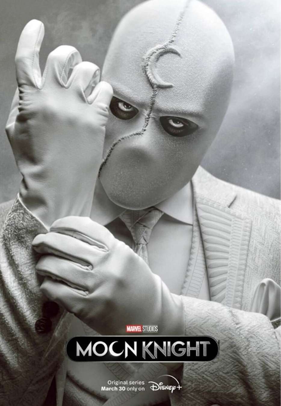Promotional poster featuring Moon Knight, portrayed by a light-skinned adult male, in a white suit with a crescent moon-shaped mask.