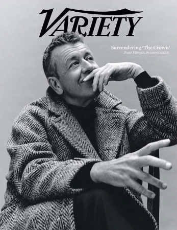 Black and white portrait of Peter Morgan on the cover of Variety, wearing a herringbone coat, resting his chin on his hand.