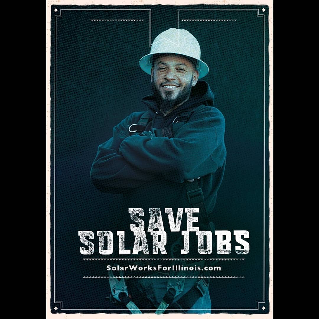 Portrait of an African-American man in work clothes and hard hat, arms crossed, smiling, over a poster for solar jobs in Illinois.