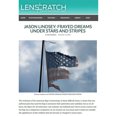 American flag with frayed edges, stars, and stripes against a cloudy sky, symbolizing freedom, national pride, and resilience.