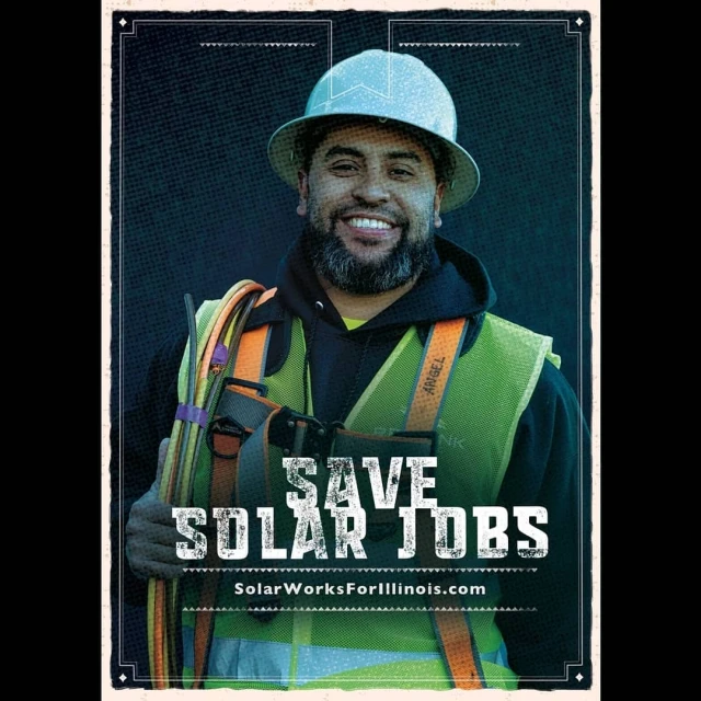 Smiling worker in hard hat and safety vest.  A motivational campaign image about solar jobs with the text 'Save Solar Jobs'.
