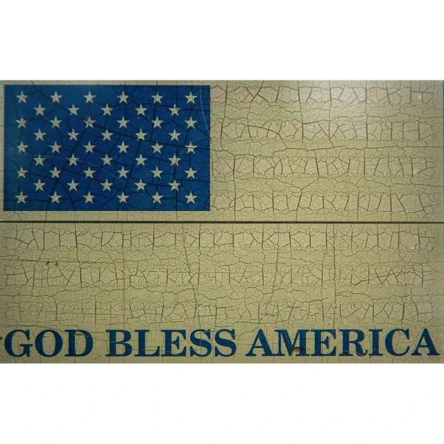 American flag graphic on a cracked, textured surface with 'God Bless America' text in blue, creating a patriotic and aged aesthetic.