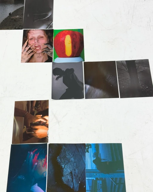 A collage of printed photographic images with subjects including a person, fruit, silhouette, landscape, and partial figures on a white surface.