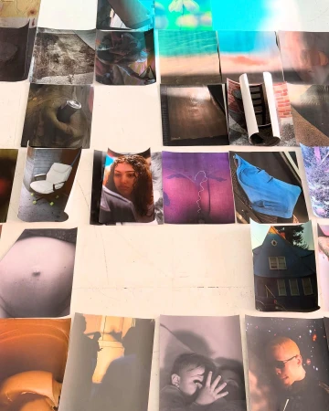 Collage of various photographic prints arranged on a white surface, featuring portraits, landscapes, objects, and architectural images.