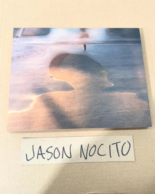 Abstract seascape photograph printed on wood, displaying soft gradients of blues and pinks with a textural, water-like effect.