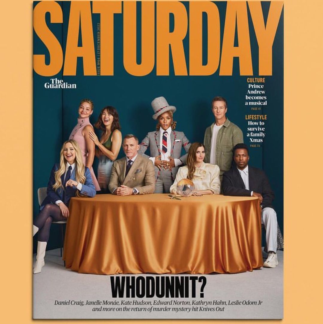 Magazine cover featuring a group of diverse adults sitting at a table, teal background, with the magazine title 'Saturday' in orange letters.