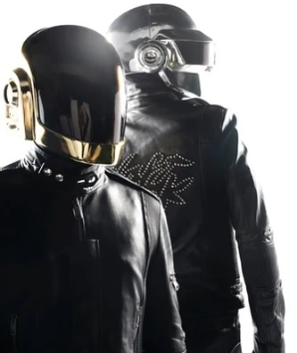 Two musicians wear Daft Punk-style helmets and black leather jackets, standing in a brightly lit, neutral setting.