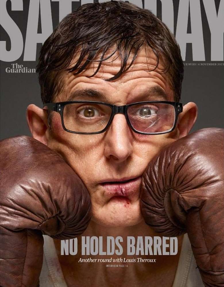 Magazine cover featuring a man with boxing gloves and a bruised face, wearing glasses. Text overlay includes the magazine's name.