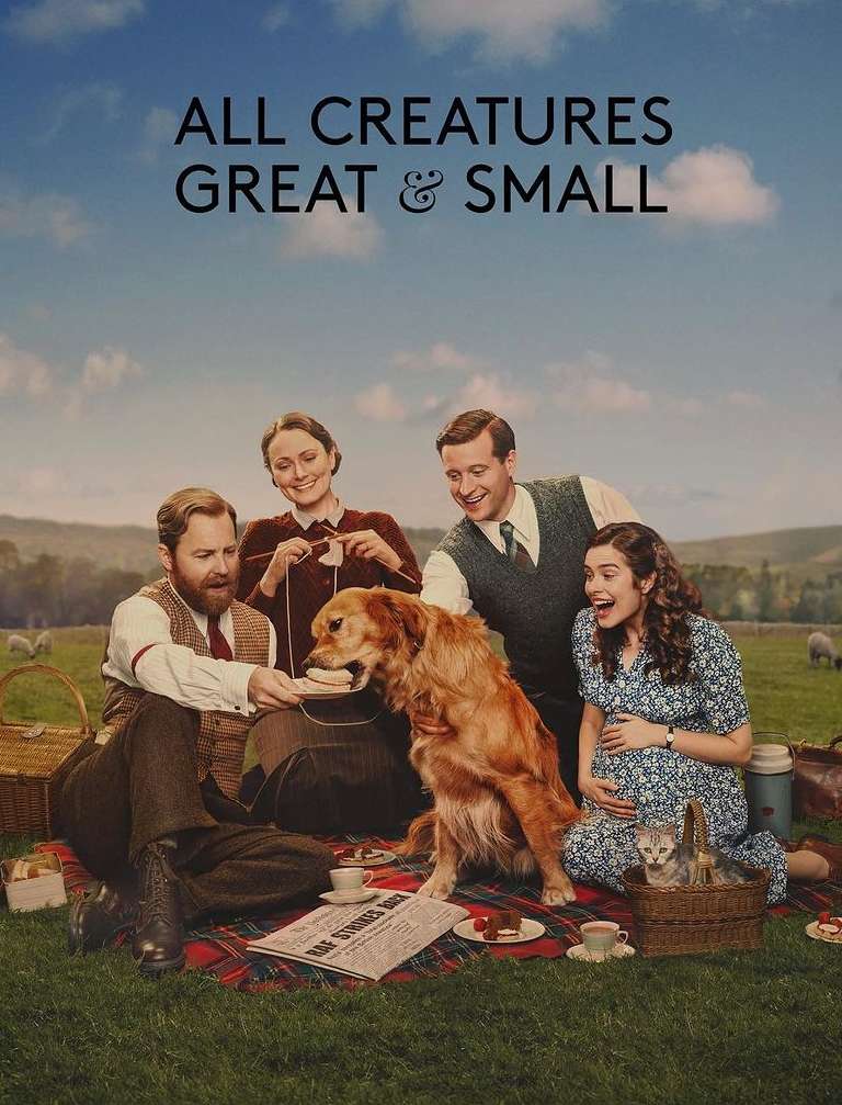 Outdoor picnic scene featuring four adults, a Golden Retriever, and a kitten, set against a scenic backdrop of rolling hills and blue skies.