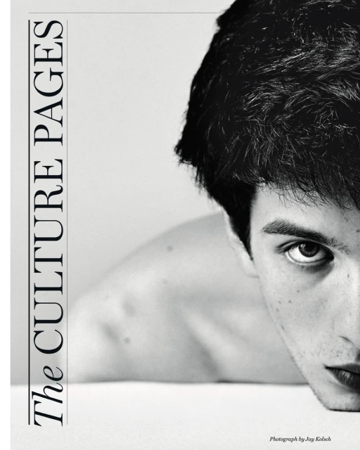 Monochromatic portrait of a young adult male looking intently at the camera, with a magazine cover design on the left side of the frame.