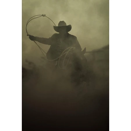 A cowboy rides a horse in a sepia-toned image, holding a lasso, showcasing a Western theme in a smoky, dusty outdoor setting.